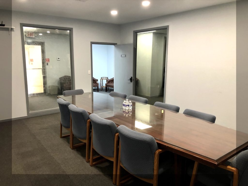 Fully equipped room with conference table, chairs, computer monitor and wi-fi